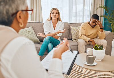 Buy stock photo Interracial couple, counseling and therapist with argument and fight on therapy sofa. Tired, relationship stress and marriage problem of people on couch feeling anxiety from divorce conversation