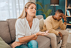 Interracial couple, counseling and frustrated woman and black man on therapy sofa talking. Tired, relationship stress and marriage problem of people on couch feeling anxiety from divorce conversation