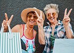 Peace, fun and portrait of women shopping in the city for bonding, holiday and weekend fun. Carefree, excited and elderly friends with bags after a sale, retail discount and ecommerce in town