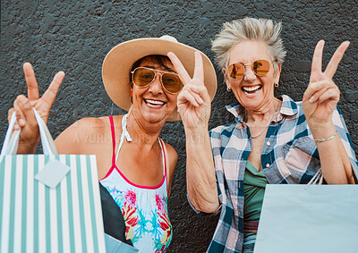 Buy stock photo Peace, fun and portrait of women shopping in the city for bonding, holiday and weekend fun. Carefree, excited and elderly friends with bags after a sale, retail discount and ecommerce in town