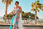 Senior woman on scooter, sustainable travel and adventure in Miami street, summer and fun in sun with happiness. Excited, ebike and eco friendly transportation, retirement and clean carbon footprint 