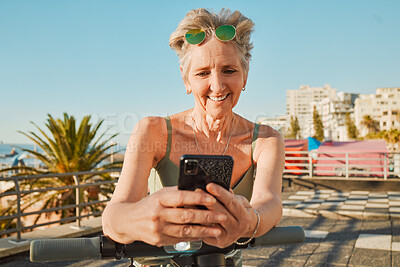 Buy stock photo Holiday, promenade or senior woman with smartphone, connection or scooter on weekend trip. Mature female, old lady or cellphone for typing, social media or share adventure, journey or tropical island