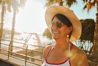Buy stock photo Travel, peace and senior woman at the beach for summer, walk and weekend fun in Bali. Sun, smile and elderly person on holiday at the sea to relax during the start of retirement by the ocean