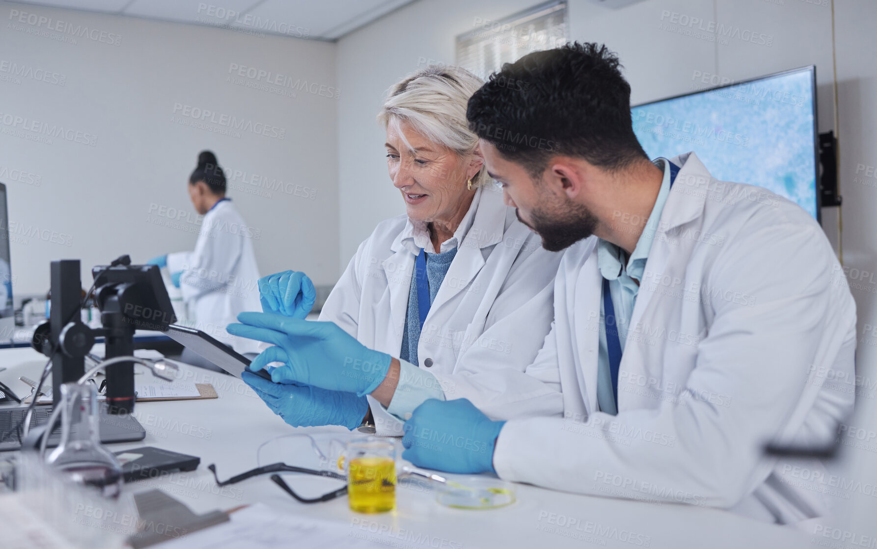 Buy stock photo Communication, teamwork or scientist working on tablet in lab for medical search, innovation or science study in lab. Medicine or doctors assistant on tech for healthcare or wellness DNA research