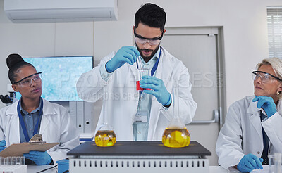 Buy stock photo Team, chemistry and liquid in laboratory, science and teaching with experiment, test tube and development. Staff, scientist and researchers with analysis, cure and diagnosis in lab, focus and sample