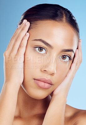 Buy stock photo Woman touch face for beauty, skincare and blue background for wellness, cosmetics and salon spa results. Portrait, facial and studio model with healthy aesthetic, laser dermatology and natural shine 