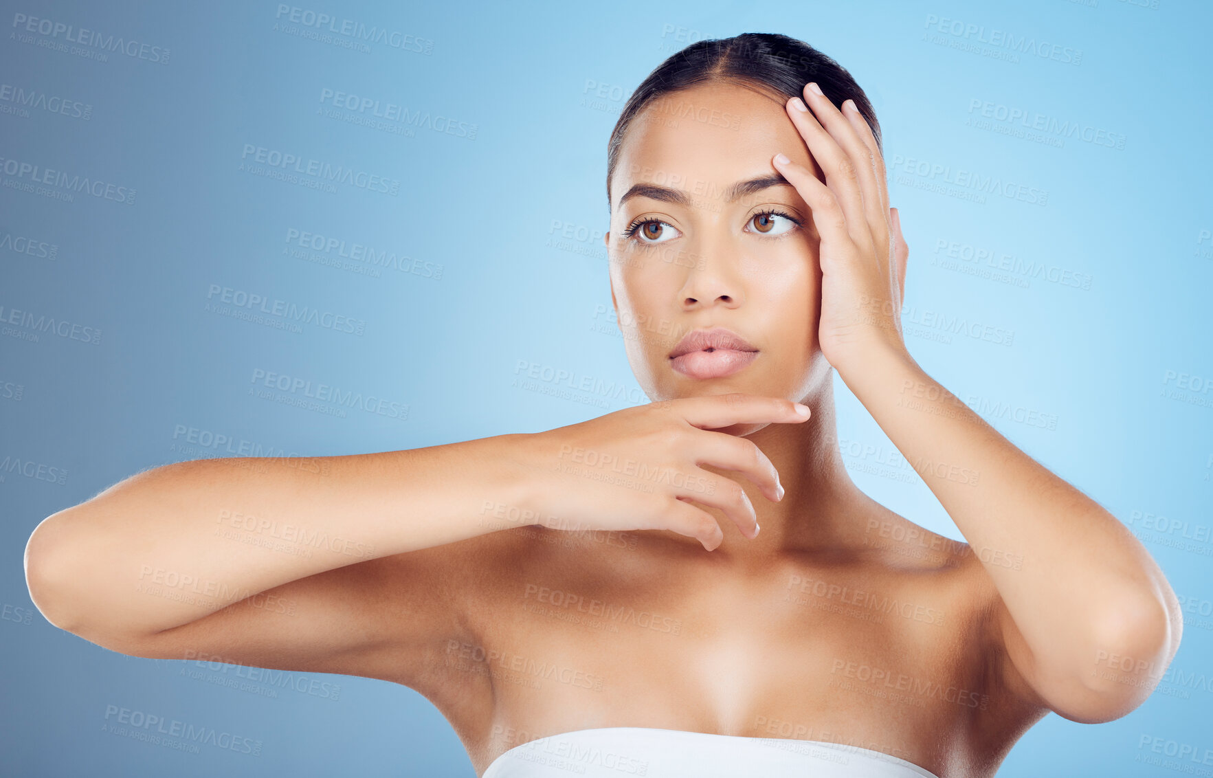 Buy stock photo Hands frame face, beauty and woman with skincare, natural cosmetics with dermatology on blue background. Healthy skin, glow and shine with wellness, cosmetic care and facial treatment with manicure