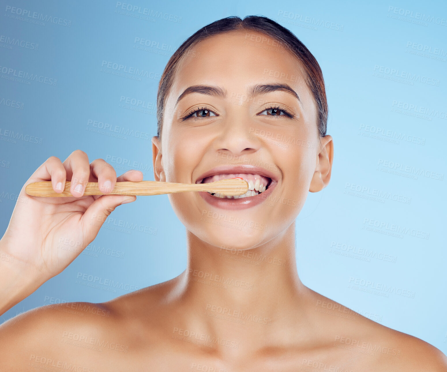 Buy stock photo Teeth, woman and portrait of bamboo toothbrush for dental wellness, healthy cleaning or beauty cosmetics. Happy female, eco wooden brush and toothpaste of mouth, face smile and studio blue background