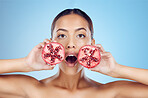 Pomegranate skincare, surprise woman and portrait for beauty, detox wellness and studio background. Model face, healthy red fruits and natural diet for facial nutrition, aesthetic dermatology and wow