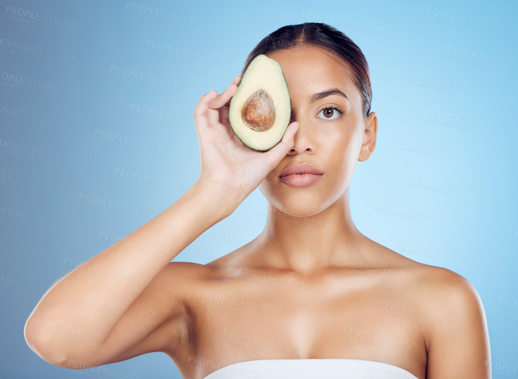 Buy stock photo Avocado, studio portrait and woman with healthy skincare for wellness, face beauty and vegan makeup. Model, green fruits and natural cosmetics for detox, facial nutrition and aesthetic glow benefits