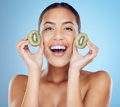 Buy stock photo Kiwi, woman and portrait of smile for skincare, beauty and wellness food on studio background. Happy model, organic green fruits and natural cosmetics for detox, facial benefits and aesthetic glow 