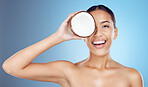 Coconut, woman and portrait for natural beauty, face wellness and studio background. Happy model, tropical summer fruits and cosmetics salon of detox food, healthy facial skincare or aesthetic makeup