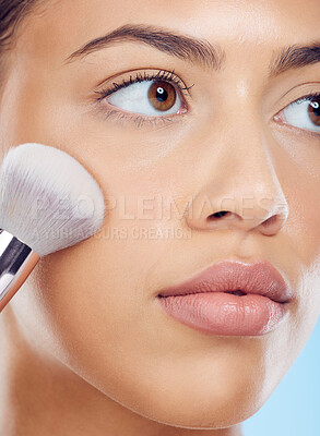 Buy stock photo Makeup, woman and brush with cosmetics, dermatology and morning routine on blue studio background. Skincare, female and lady tools, salon treatment and luxury for grooming, foundation and smooth skin