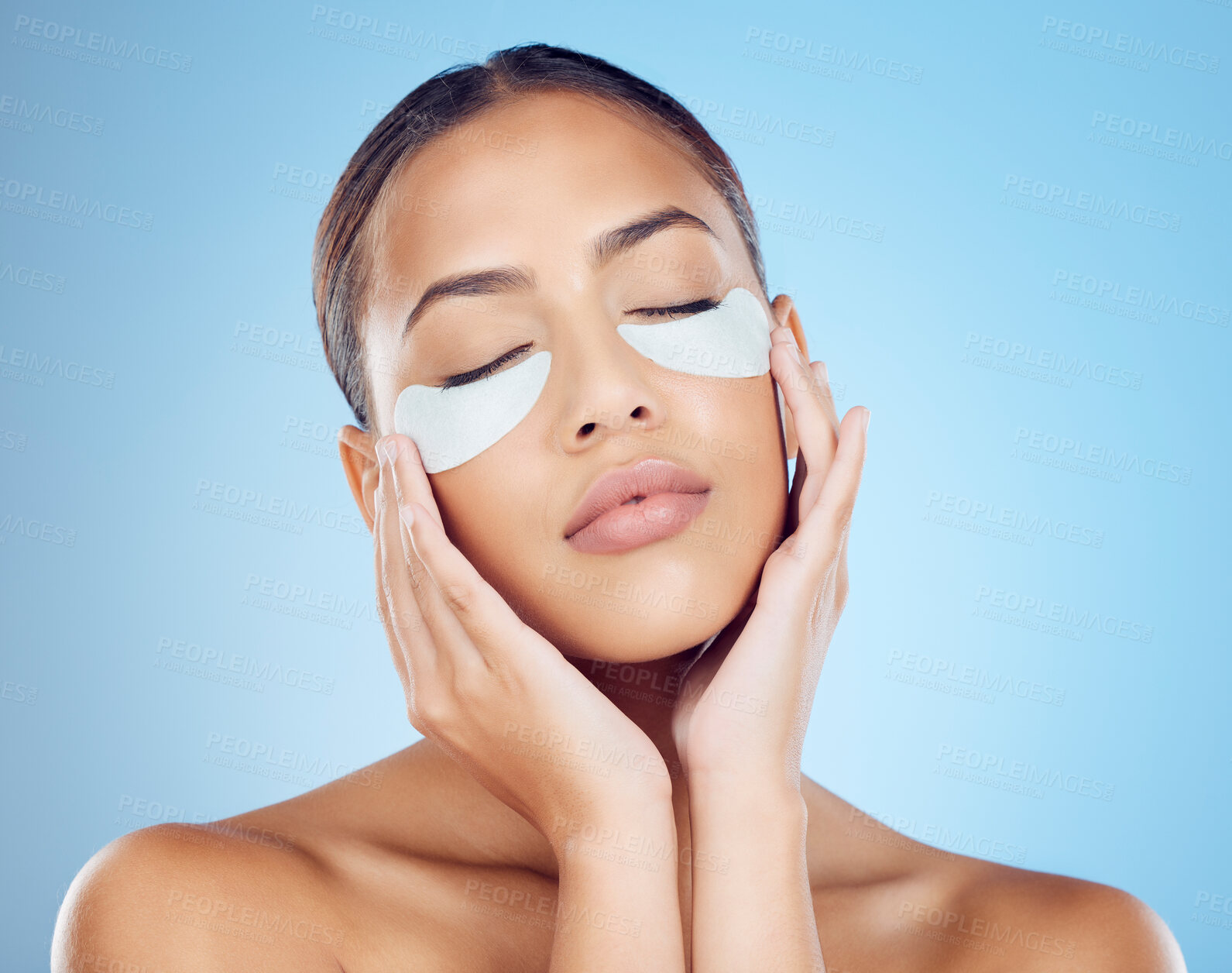 Buy stock photo Skincare, mask for eyes and face of woman on blue background for wellness, cosmetics and facial treatment. Beauty, luxury spa and girl relax with eye pads for dermatology, healthy skin and self care