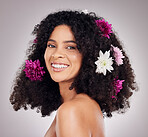 Portrait, black woman and hair care, flowers and shine with smile, girl and grey studio background. Face, African American female or clean scalp with salon treatment, florals or happiness on backdrop