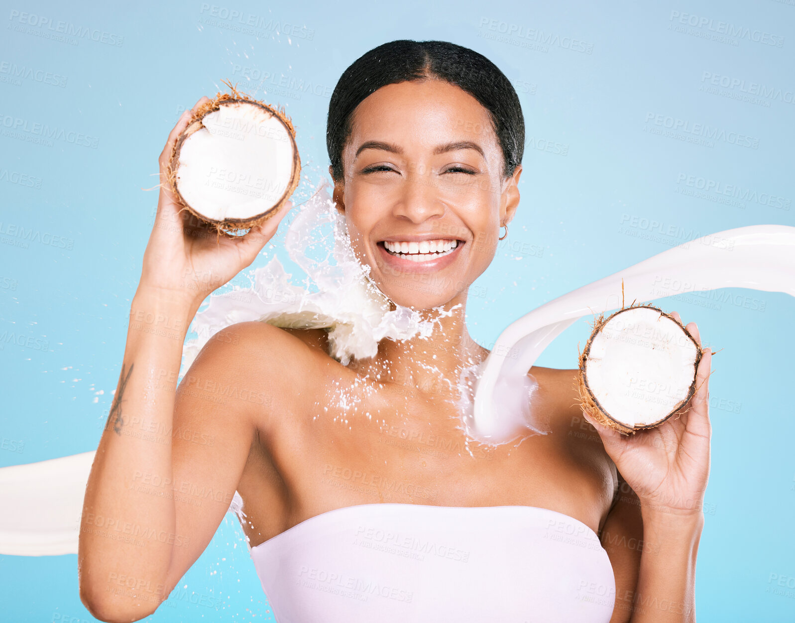 Buy stock photo Skin care, beauty and woman portrait with coconut for healthy skin and diet on a blue background. Face of aesthetic model person with milk splash and fruit for sustainable facial health and wellness