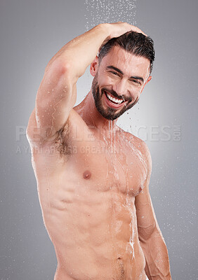 Buy stock photo Shower, cleaning and portrait of man with water on gray background for wellness, grooming and beauty. Skincare, bathroom hygiene and male smile for washing body, clean face and soap for healthy skin