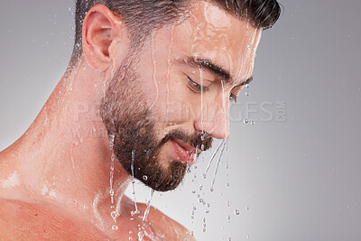 Buy stock photo Cleaning, shower water and man doing beauty, skincare and wellness morning routine in studio. Facial health, relax and male model in isolated gray background with face profile and dermatology