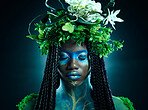 Black woman, plant crown and beauty of face with makeup on dark background with tropical leafs. Fairy model person or Queen of nature, ecology and sustainability for freedom art with natural wreath