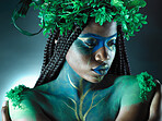 Beauty, black woman and plant crown with face makeup on dark background with tropical leaf. Fairy model person or Queen of nature, ecology and sustainability for freedom art with natural wreath