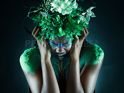 Buy stock photo Frustrated, nature and mother earth model feeling sad from climate change in studio. Costume makeup, angry and black person with isolated and dark background upset about pollution and environment