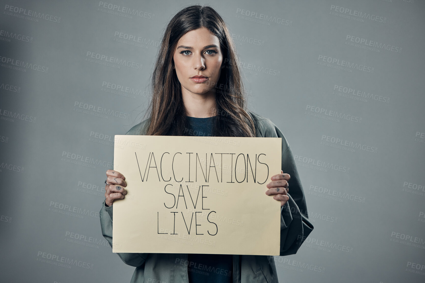 Buy stock photo Woman, protest and poster for vaccination, flu shot or health and safety against gray studio background. Portrait of female activist with billboard for healthcare, covid or vaccine message on mockup