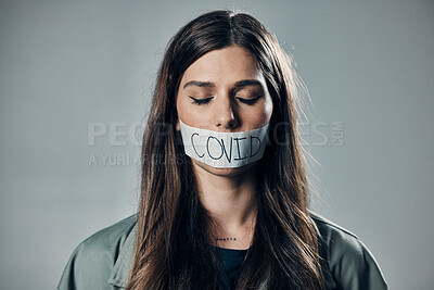 Buy stock photo Woman, tape and mouth with silence for protest, social activism and fight against covid 19 by background. Human rights, gen z girl and studio with healthcare opinion for  freedom, choice and vision