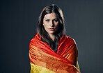 Flag, pride and woman in portrait, lgbtq and freedom to love, inclusion and equality, protest for human rights. Gay, trans and lesbian, politics and identity with lgbt community on studio background