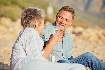 Buy stock photo Champagne, beach and love celebration of mature couple with care and support of marriage. Toast, wine and sea picnic of a old man and woman together on holiday in summer loving the sunshine outdoor