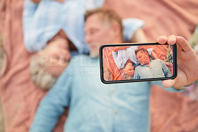 Buy stock photo Relax, love and selfie with phone screen and old couple on picnic for bonding, anniversary and celebration. Happy, technology and picture with senior man and woman for health, social media and summer