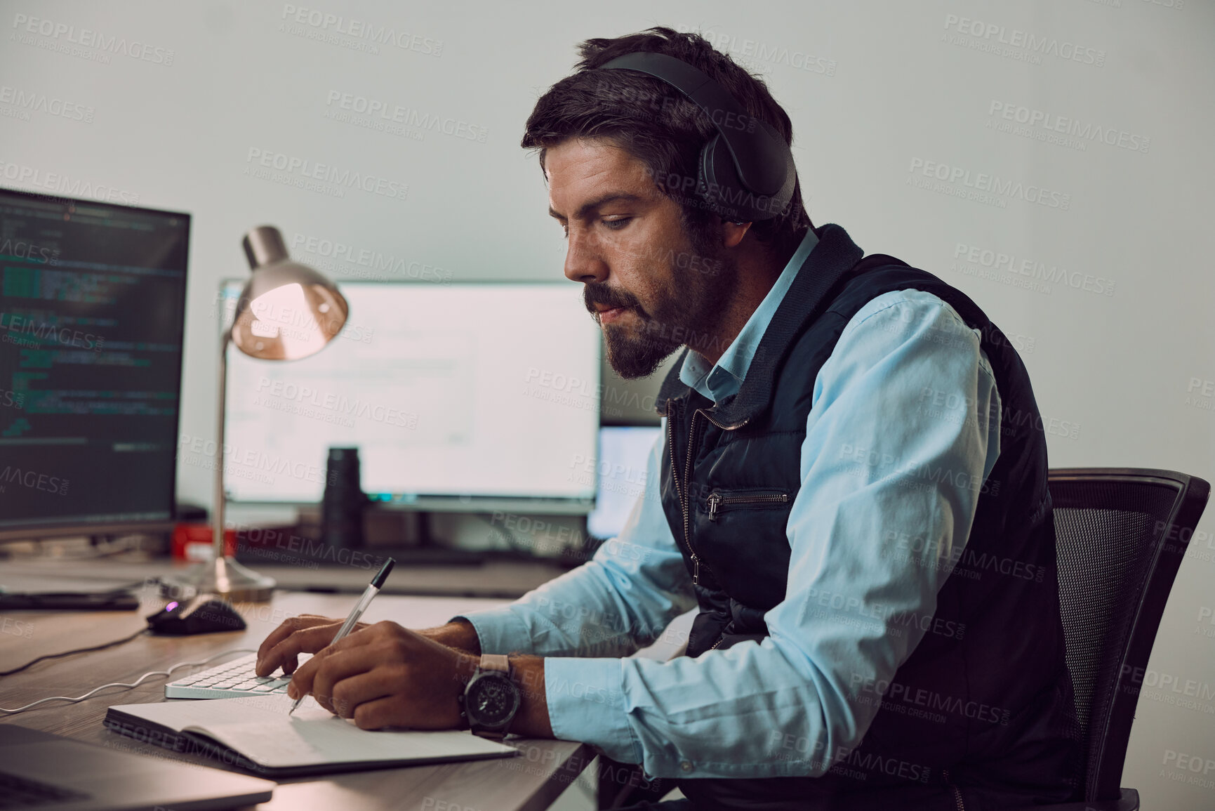Buy stock photo Business man, writing and headphones in office with blank computer screen and notebook. Information technology, coding research and tech notes of a it employee planning a work schedule and project