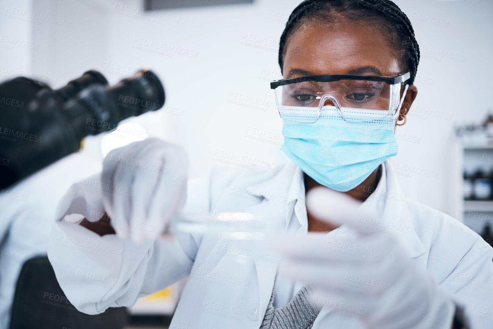 Buy stock photo Science, covid and solution with a black woman doctor working in a laboratory for research or innovation. Medical, analytics and development with a female scientist at work in a lab for chemistry