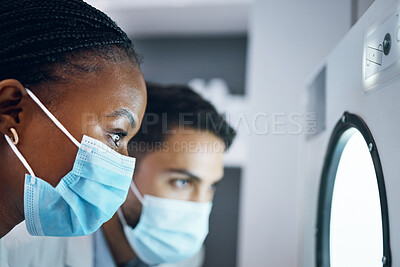 Buy stock photo Science, researchers and incubator for experiment, healthcare and medical breakthrough in laboratory. Scientist, glass and employees with masks, innovation and test sample storage for data analysis