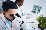 Science, research and male scientist with a microscope for an analysis, test or experiment in medical lab. Innovation, biotechnology and man pharmaceutical researcher or expert working in laboratory.