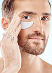 Eye, beauty mask and portrait of a man with dermatology cosmetics with collagen benefits for skin. Aesthetic model person with gel patch for skincare, self care and spa facial for health and wellness