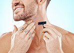 Hands, shave and beard with a man grooming in studio on a blue background for skincare or hygiene. Shaving, tattoo and neck with a male in the bathroom for hair removal as part of a morning routine