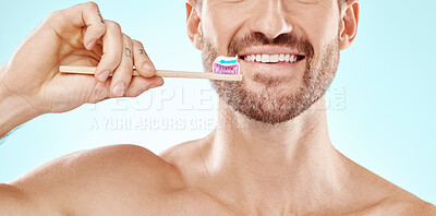 Buy stock photo Smile, mouth or man brushing teeth with dental toothpaste for healthy oral hygiene grooming in studio. Eco friendly, self care or male model cleaning with a product or natural bamboo wood toothbrush