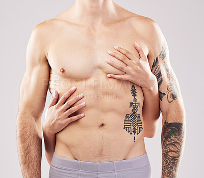 Buy stock photo Woman, hands and touch on man chest, abdomen and muscle by studio background for sensual aesthetic. Model, anatomy and sexy with girl, tattoo and six pack for wellness, fitness and health by backdrop