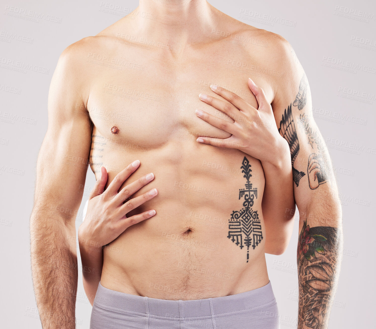 Buy stock photo Woman, hands and touch on man chest, abdomen and muscle by studio background for sensual aesthetic. Model, anatomy and sexy with girl, tattoo and six pack for wellness, fitness and health by backdrop