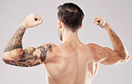 Back, muscular and man with skincare, bodybuilder and fitness against grey studio background. Male, gentleman and athlete with muscles, dermatology and training for competition, workout and backdrop