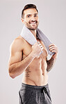 Body, man in portrait and fitness with beauty, grooming and hygiene with health and clean on studio background. Happy, topless male with towel and cosmetics with bodybuilder, exercise and muscle