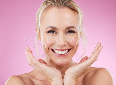 Buy stock photo Skincare, portrait of woman with smile, and hands, glowing skin with natural spa makeup in studio. Mockup, advertising and beauty, luxury cosmetics, face of happy model isolated on pink background.