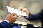 Ticket, airport and person with passport at counter for travel documentation, security ID and airplane journey. Hands, passenger and identity document for check in, booking and flight transportation