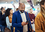 Travel, search and phone with black man in airport for flight, vacation and immigration. Queue, communication and technology with businessman in line with luggage for trip, holiday and first class