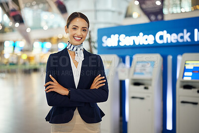 Buy stock photo Woman, passenger assistant and arms crossed at airport by self service check in station for information, help or FAQ. Portrait of happy female services agent standing ready to assist people in travel