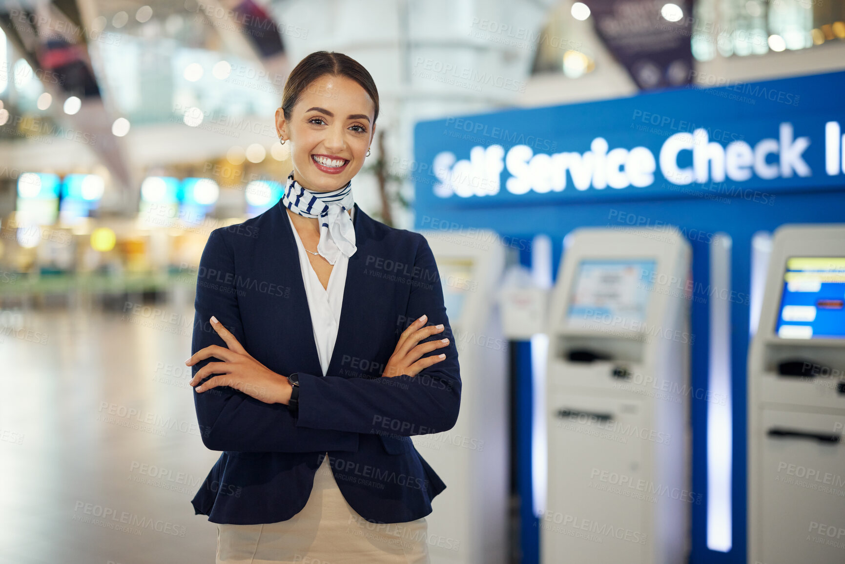 Buy stock photo Woman, passenger assistant and arms crossed at airport by self service check in station for information, help or FAQ. Portrait of happy female services agent standing ready to assist people in travel
