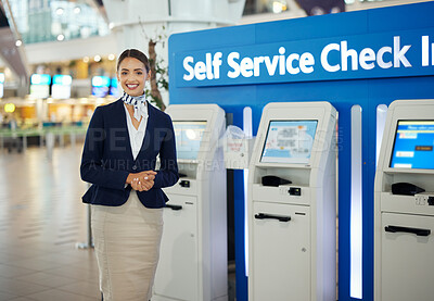 Buy stock photo Woman, passenger assistant and airport by self service check in station for information, help or FAQ. Portrait of happy female services agent standing ready to assist people in travel destination