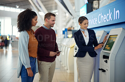 Buy stock photo Woman, service agent and couple at airport by self check in station for information, help or FAQ. Happy female passenger assistant helping travelers register, book air flight or ticket for departure