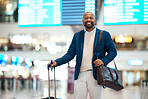 Portrait of black man, airport and smile with luggage and flight schedule display for business trip. Happiness, travel and happy businessman standing in terminal with foreign country destination.