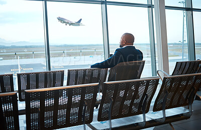 Buy stock photo Airport waiting, black man back and phone for work travel, plane and air flight. Businessman, mobile connection and person sitting with cellphone looking at traveler app info for airplane traveling